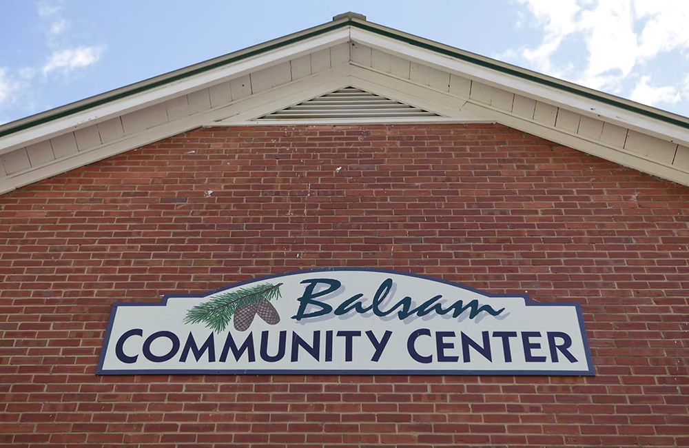 Close up of the Balsam Community Center's Logo on the front of the building